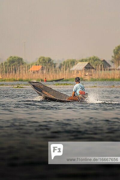 Fisherman takes his boat out on Lake Inle  Myanmar  Asia