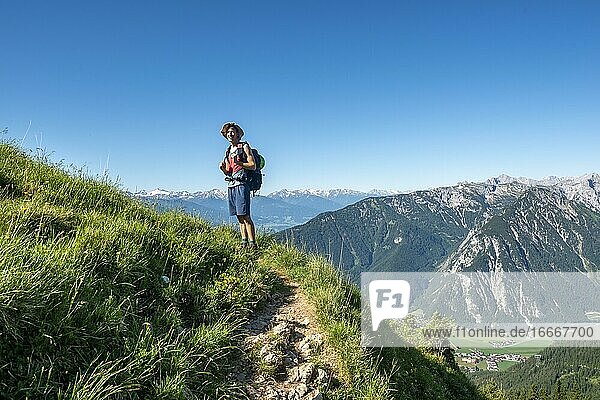 Hiker on a hiking trail  Haidachstellwand  5-summit via ferrata  hiking at the Rofan Mountains  Tyrol  Austria  Europe