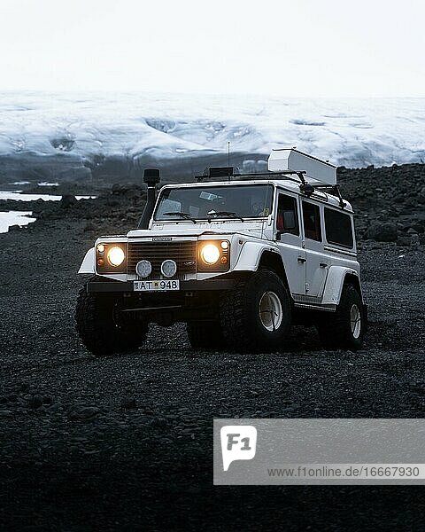 White Land Rover in front of a glacier Vatnajökull glacier Iceland Europe