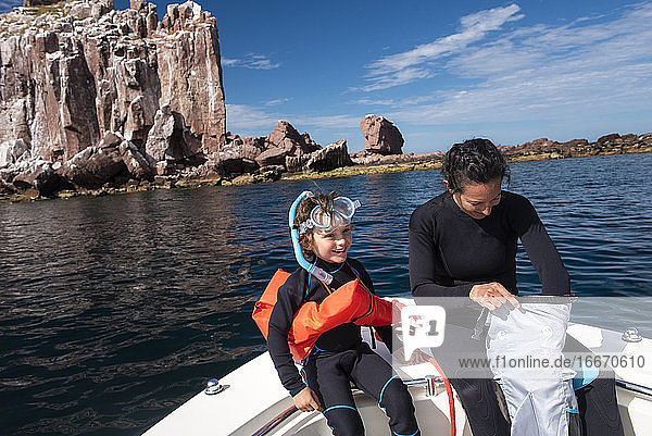 A mom and her son getting ready to snorkel at Espíritu Santo Island.