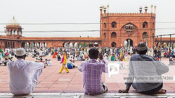 Candid view of men observing the crowd at Jama Masjid  Delhi