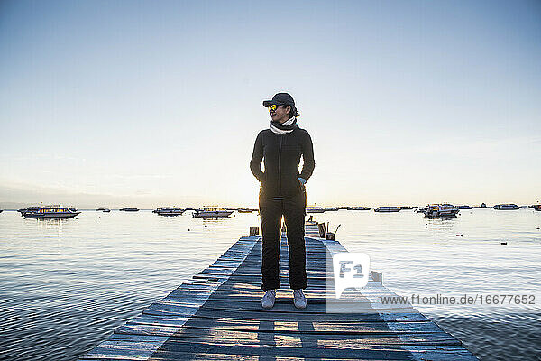 Woman standing on pier at Lake Titicaca  Copacabana  Bolivia