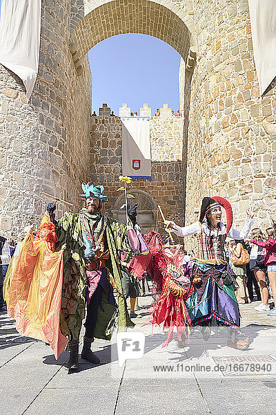A medieval festival parade next to the wonderful wall of Avila. Avila  Spain