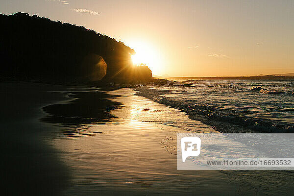 Sunset at high tide on a secluded beach in Australia
