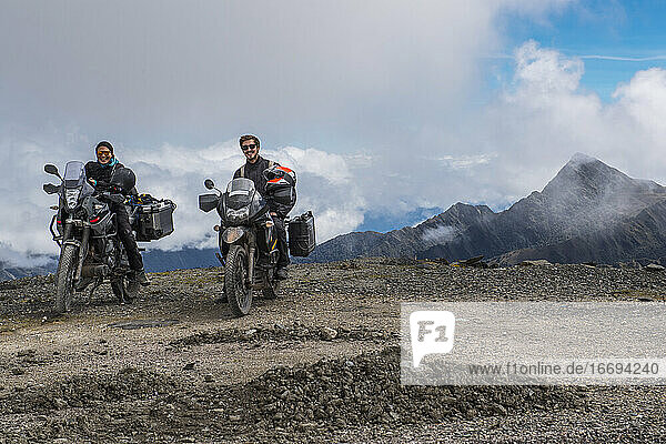 Couple on touring motorbikes at the pass of Abra de Malaga (4316 m)