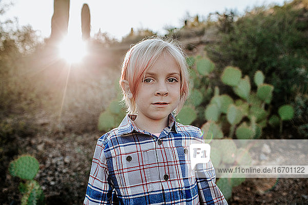 portrait of non binary child in the desert
