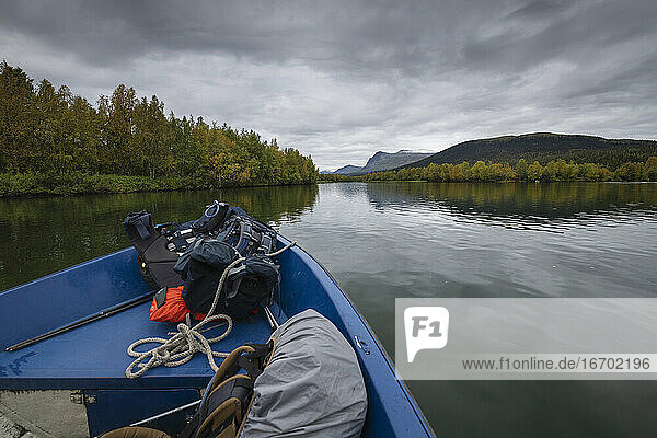 Small boat ferry carrying hikers from Kvikkjokk to trailhead of Kungsleden Trail  Lapland  Sweden