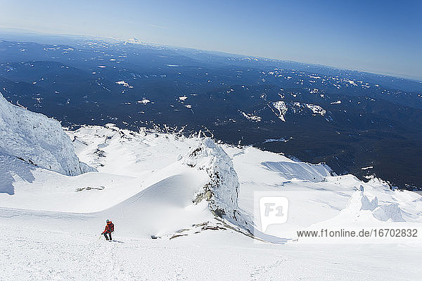 A man climbs down from the summit of Mt. Hood in Oregon.
