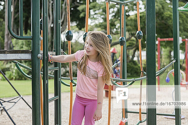 Young girl playing at the playground