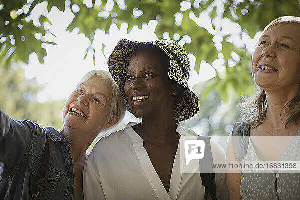 Happy senior women friends in park