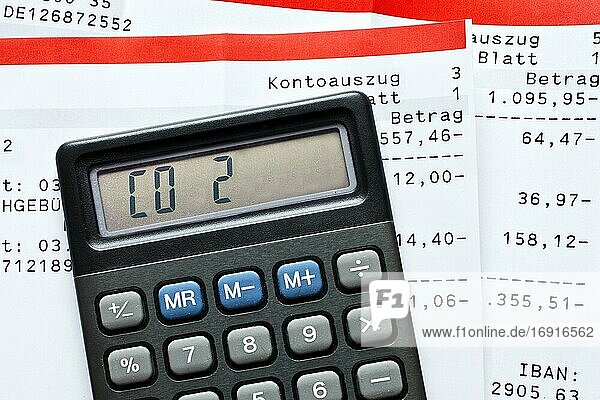 Calculator with the writing CO2 and bank statements  symbol photo for costs for climate protection  reduction of carbon dioxide  Germany  Europe