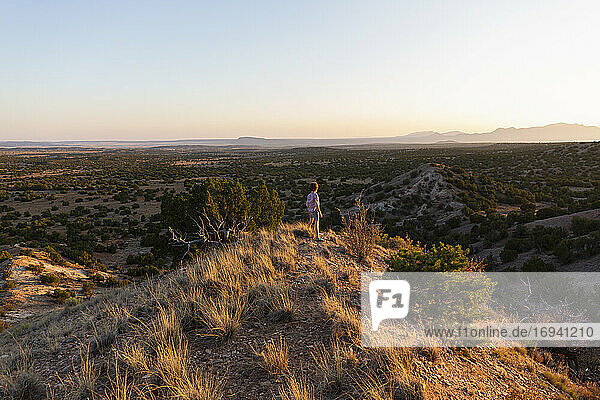 Young boy overlooking Galisteo Basin  Santa Fe