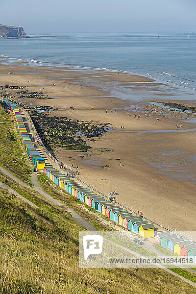 View of colourful beach huts on West Cliff Beach  Whitby  North Yorkshire  England  United Kingdom  Europe