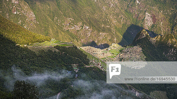 Machu Picchu Inca ruins at sunrise seen from Sun Gate (Inti Punku or Intipuncu)  Cusco Region  Peru