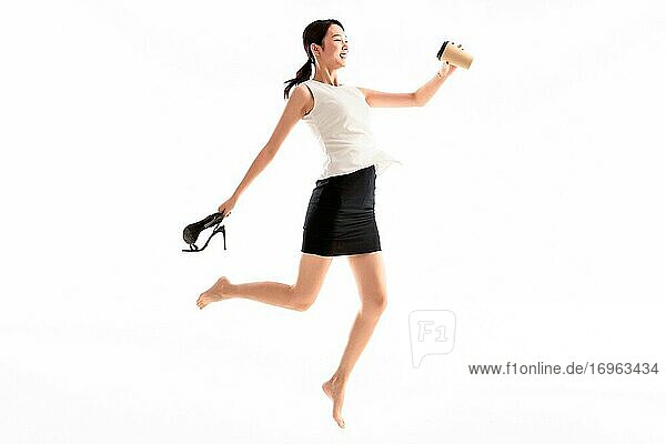 Excited jumping business young woman