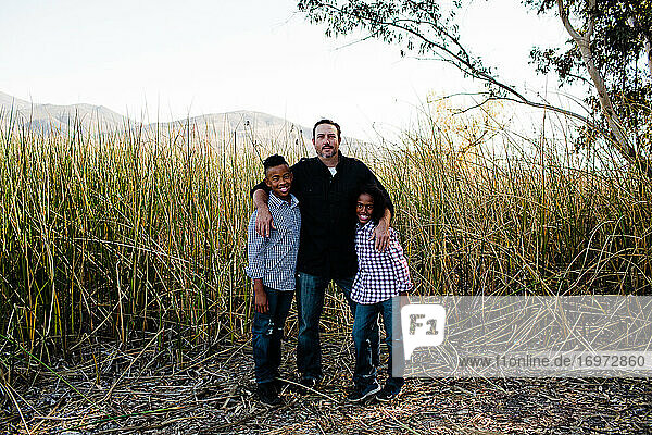 Father Posing with Sons at Park in Chula Vista