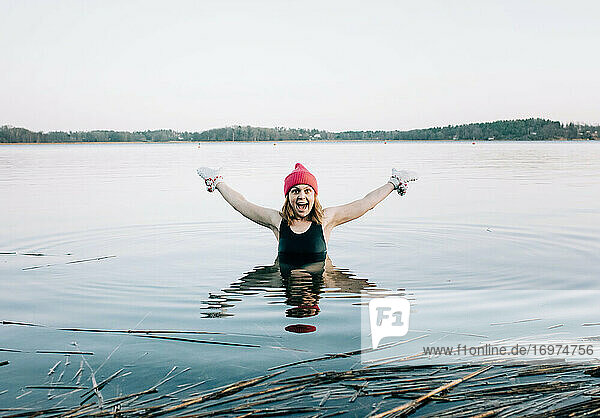 nordic woman enjoying cold water swimming in Sweden