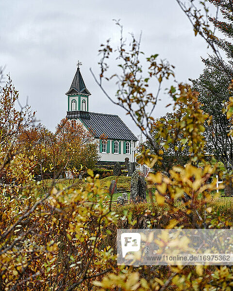 Autumn landscape with small village church