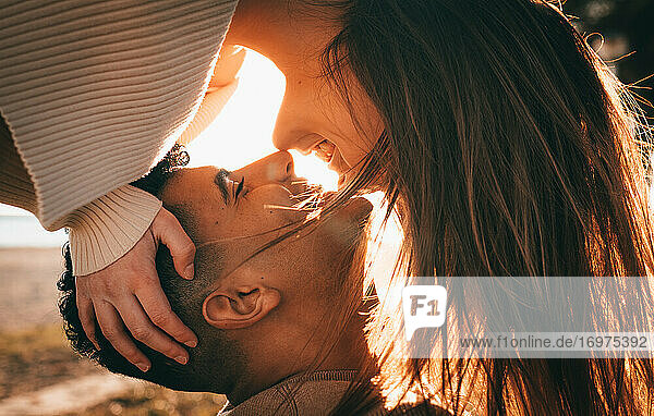 Lovely Shot Of A Young Couple In Love At Sunset
