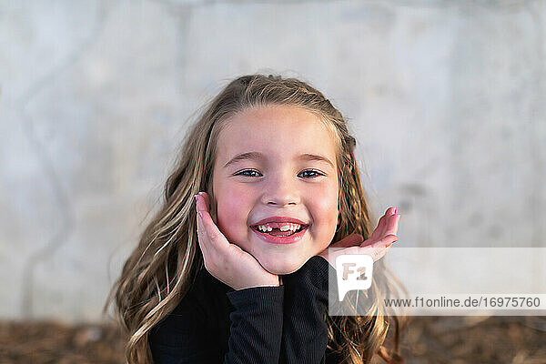 Close up photo of a smiling 7 year old girl.