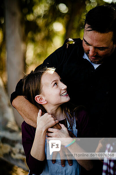 Dad & Daughter Embracing & Smiling in Chula Vista