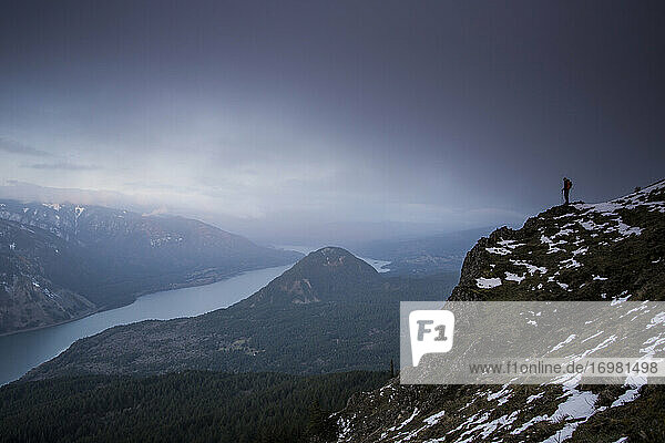 A young man hikes on Dog Mountain overlooking the Columbia Gorge.