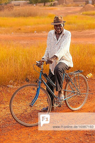 Old African man  cyclist  Bobo-Dioulasso  Burkina Faso  Africa