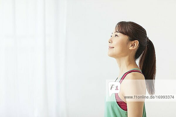 Healthy Japanese woman training at home