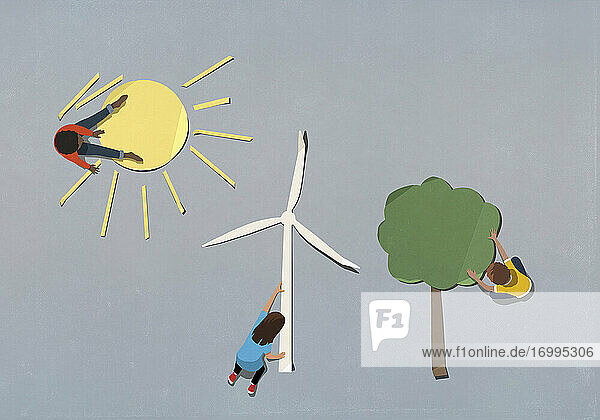 Kinder ordnen Umwelt- und Windrad-Papiersymbole