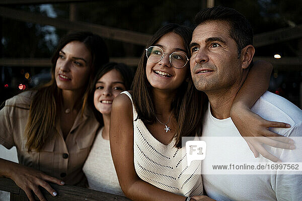 Happy family looking away while spending leisure time during vacation