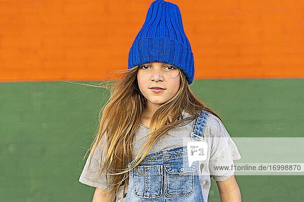 Portrait of young girl with blue woolly hat