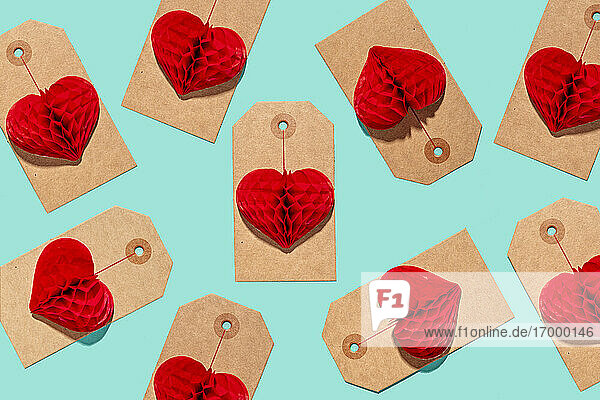 Pattern of labels with heart shaped paper craft decorations