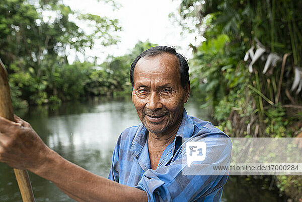Smiling senior Guarani man at Napo River  Ecuador