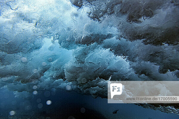 Underwater view of splashing sea wave