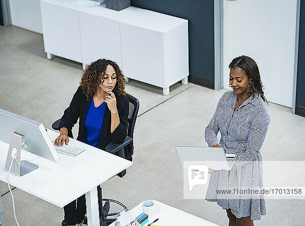 Two women working in office