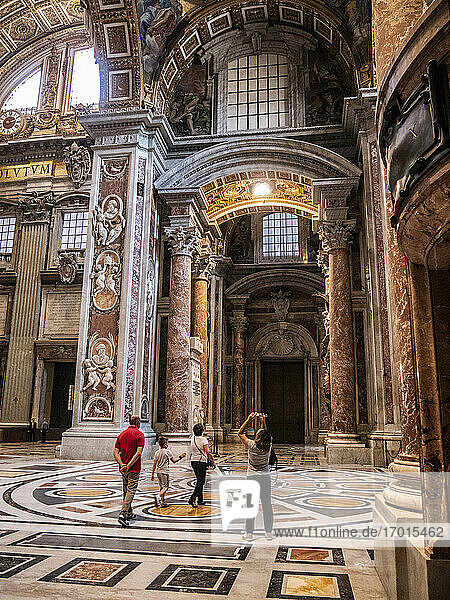 Interior view of the St Peter's Basilica with tourists  Vatican City  Italy  Rome  Europe.