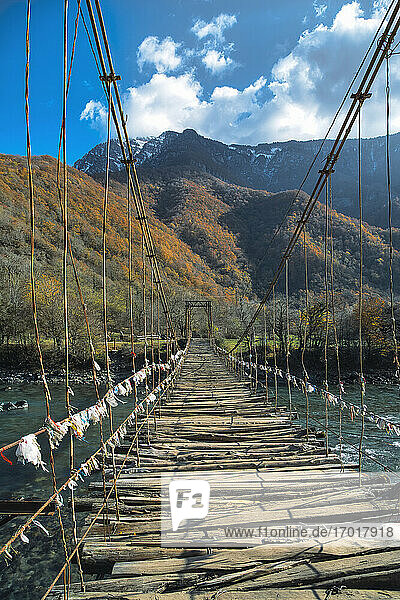Old suspension bridge stretching over Lupshara River