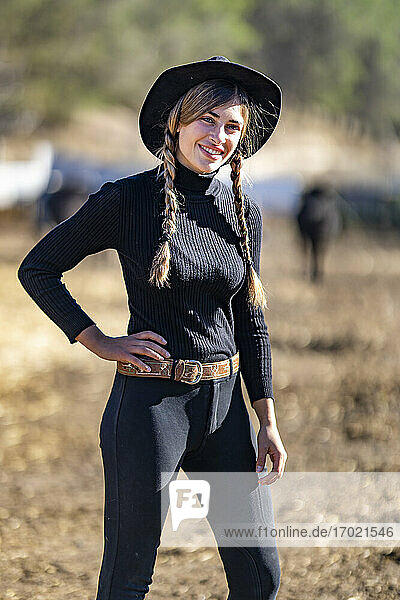 Portrait of female rancher in black hat