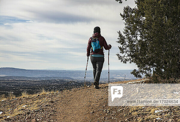 USA  New Mexico  Lamy  Galisteo Basin Preserve  Senior woman hiking in Galisteo Basin Preserve