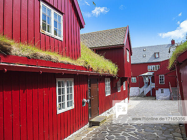 Road amidst red houses in city  Torshavn  Faroe Islands  Iceland