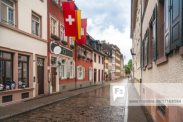 Germany  Baden-Wurttemberg  Heidelberg  Historic townhouses and hotels along empty cobblestone street