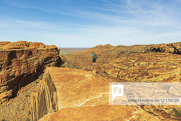 Male hiker photographing landscape of Kings Canyon