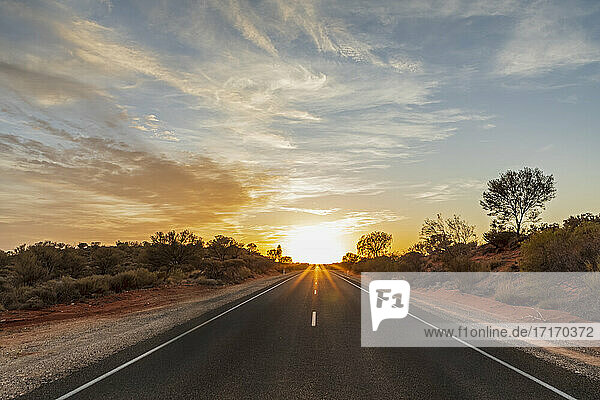 Empty Lasseter Highway at sunrise   Australia