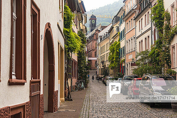 Germany  Baden-Wurttemberg  Heidelberg  Historic townhouses along cobblestone street