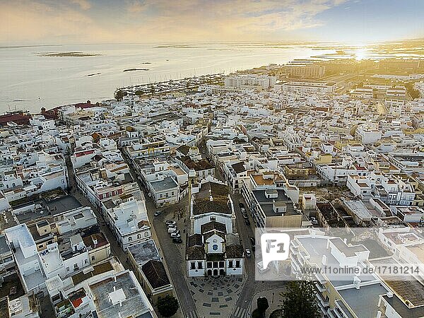 Aerial view of Olhao with a church in the foreground by sunset  Algarve  Portugal  Europe