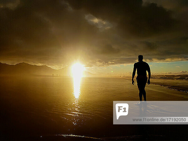 Silhouette of a man in Cofete Beach  Fuerteventura  Canary island  Spain.