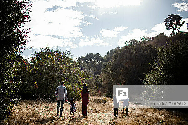 Family of Five Walking in Field in San Diego