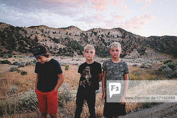 Three Boys Standing Roadside in the Cuyama Valley at Sunset