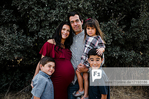 Family of Five Smiling for Camera in San Diego