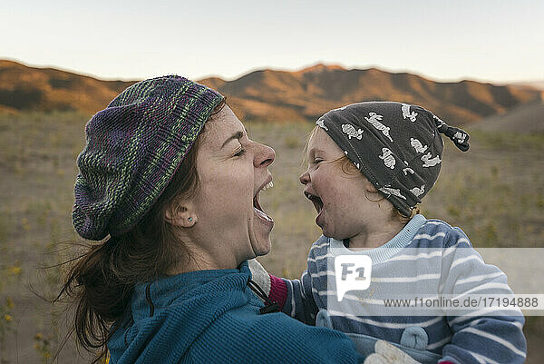 Mother and daughter having fun in the desert